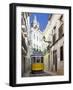 Tram (Electricos) Along Rua Das Escolas Gerais with Tower of Sao Vicente de Fora, Lisbon, Portugal-Stuart Black-Framed Photographic Print