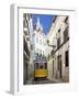 Tram (Electricos) Along Rua Das Escolas Gerais with Tower of Sao Vicente de Fora, Lisbon, Portugal-Stuart Black-Framed Photographic Print