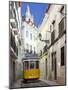 Tram (Electricos) Along Rua Das Escolas Gerais with Tower of Sao Vicente de Fora, Lisbon, Portugal-Stuart Black-Mounted Photographic Print