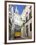 Tram (Electricos) Along Rua Das Escolas Gerais with Tower of Sao Vicente de Fora, Lisbon, Portugal-Stuart Black-Framed Photographic Print