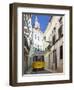 Tram (Electricos) Along Rua Das Escolas Gerais with Tower of Sao Vicente de Fora, Lisbon, Portugal-Stuart Black-Framed Photographic Print