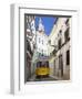 Tram (Electricos) Along Rua Das Escolas Gerais with Tower of Sao Vicente de Fora, Lisbon, Portugal-Stuart Black-Framed Photographic Print