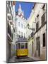 Tram (Electricos) Along Rua Das Escolas Gerais with Tower of Sao Vicente de Fora, Lisbon, Portugal-Stuart Black-Mounted Photographic Print