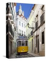 Tram (Electricos) Along Rua Das Escolas Gerais with Tower of Sao Vicente de Fora, Lisbon, Portugal-Stuart Black-Stretched Canvas