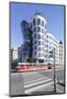 Tram in Front of the Dancing House (Ginger and Fred) by Frank Gehry-Markus Lange-Mounted Photographic Print