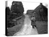 Tramp Named John Walpole Walking in Village Carrying Bag over His Shoulder-null-Stretched Canvas