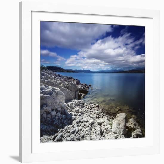 Tranquil Lake and Rocky Shore Against Cloudy Sky, Sardinia, Italy-null-Framed Photographic Print