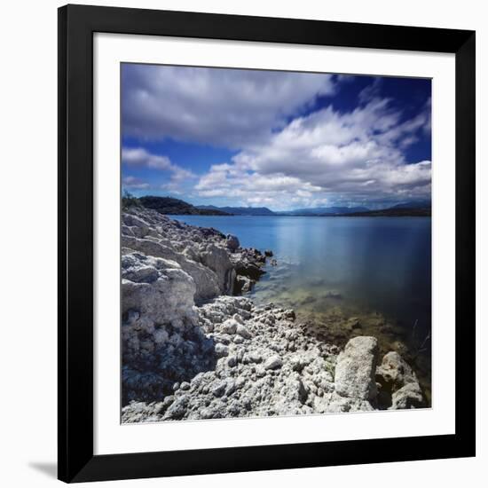 Tranquil Lake and Rocky Shore Against Cloudy Sky, Sardinia, Italy-null-Framed Photographic Print