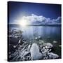 Tranquil Lake and Rocky Shore with Sun over Horizon, Sardinia, Italy-null-Stretched Canvas