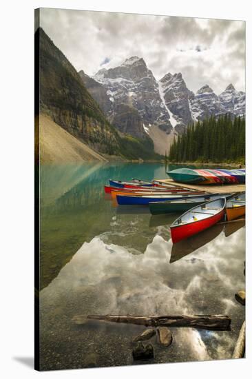 Tranquil setting of rowing boats on Moraine Lake, Banff National Park, UNESCO World Heritage Site, -Frank Fell-Stretched Canvas