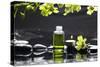 Tranquil Spa Scene - Massage Oil and Candle on Black Stones with Green Orchid-crystalfoto-Stretched Canvas