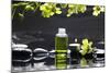 Tranquil Spa Scene - Massage Oil and Candle on Black Stones with Green Orchid-crystalfoto-Mounted Photographic Print