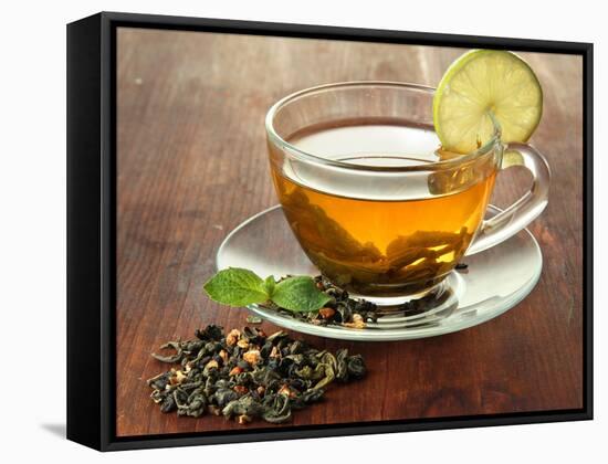 Transparent Cup of Green Tea with Lime on Wooden Background-Yastremska-Framed Stretched Canvas