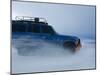 Travelers Drive over a Flooded Salt Flat in Bolivia-Sergio Ballivian-Mounted Photographic Print