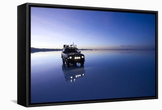 Travelers Drive their Suv across a the Salar De Uyuni, a Flooded Salt Flat, in Bolivia-Sergio Ballivian-Framed Stretched Canvas