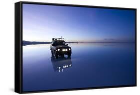 Travelers Drive their Suv across a the Salar De Uyuni, a Flooded Salt Flat, in Bolivia-Sergio Ballivian-Framed Stretched Canvas