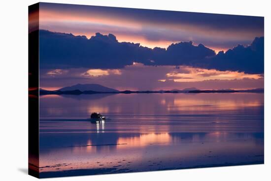 Travelers Drive their Suv across a the Salar De Uyuni, a Flooded Salt Flat, in Bolivia-Sergio Ballivian-Stretched Canvas