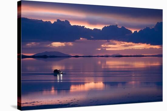 Travelers Drive their Suv across a the Salar De Uyuni, a Flooded Salt Flat, in Bolivia-Sergio Ballivian-Stretched Canvas