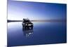 Travelers Drive their Suv across a the Salar De Uyuni, a Flooded Salt Flat, in Bolivia-Sergio Ballivian-Mounted Photographic Print