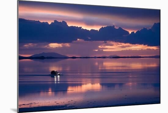 Travelers Drive their Suv across a the Salar De Uyuni, a Flooded Salt Flat, in Bolivia-Sergio Ballivian-Mounted Photographic Print