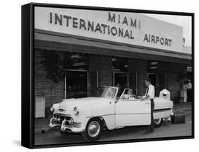Travelers in a Chevy Bel Air Convertible at the Miami International Airport, 1954 August 22-null-Framed Stretched Canvas
