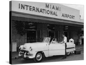 Travelers in a Chevy Bel Air Convertible at the Miami International Airport, 1954 August 22-null-Stretched Canvas