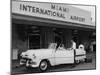 Travelers in a Chevy Bel Air Convertible at the Miami International Airport, 1954 August 22-null-Mounted Photographic Print