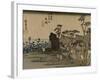 Travelers Walk in the Rain Toward a Narrow Street with Huts, Behind the Sea Is Visible-Utagawa Hiroshige-Framed Art Print