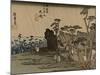 Travelers Walk in the Rain Toward a Narrow Street with Huts, Behind the Sea Is Visible-Utagawa Hiroshige-Mounted Art Print