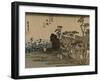 Travelers Walk in the Rain Toward a Narrow Street with Huts, Behind the Sea Is Visible-Utagawa Hiroshige-Framed Art Print