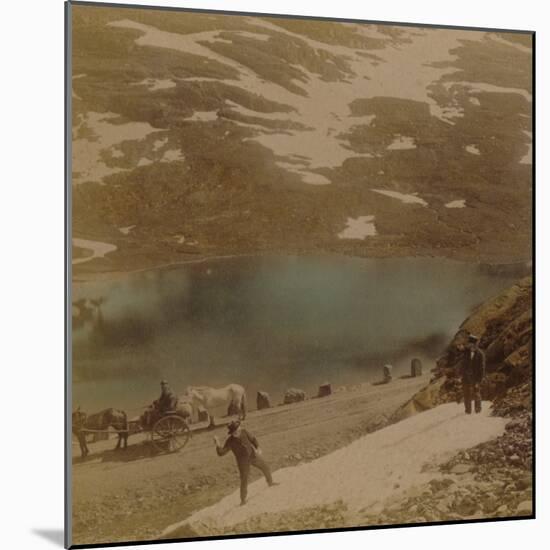 'Travellers with July snowballs, on road over the Haukeli mountains, Norway'-Elmer Underwood-Mounted Photographic Print