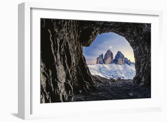 Tre Cime di Lavaredo lit by moon seen from opening in rocks of a war cave, Sesto Dolomites-Roberto Moiola-Framed Photographic Print