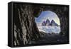 Tre Cime di Lavaredo lit by moon seen from opening in rocks of a war cave, Sesto Dolomites-Roberto Moiola-Framed Stretched Canvas