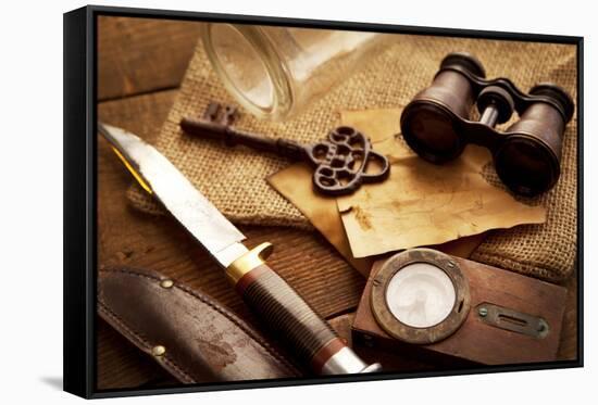 Treasure Hunting Setting, A Compass, Binoculars, Knife and a Old Key on a Old Wooden Desk-landio-Framed Stretched Canvas