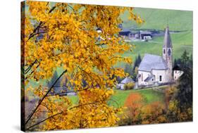 Tree with yellow leaves with the church of Santa Magdalena in the background, Funes Valley, Sudtiro-Francesco Bergamaschi-Stretched Canvas