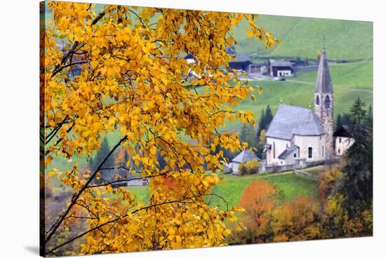 Tree with yellow leaves with the church of Santa Magdalena in the background, Funes Valley, Sudtiro-Francesco Bergamaschi-Stretched Canvas
