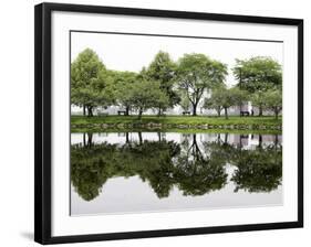 Trees are Reflected in Still Water on the Esplanade Along the Charles River in Boston-null-Framed Photographic Print