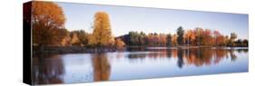 Trees in Autumn along a Lake, Canterbury, New Hampshire, England-null-Stretched Canvas