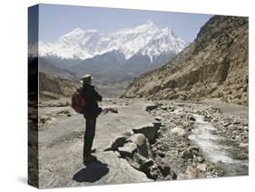 Trekker Enjoys the View on the Annapurna Circuit Trek, Jomsom, Himalayas, Nepal-Don Smith-Stretched Canvas