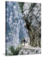Trekker Walks the Trail Through the Cares Gorge, One of the Most Popular Walks in Spain-John Warburton-lee-Stretched Canvas