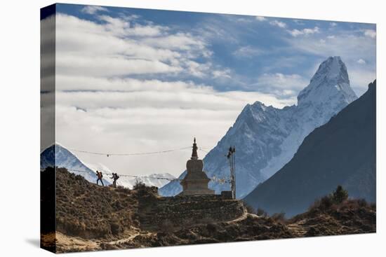 Trekkers Near a Chorten in the Everest Region with the Peak of Ama Dablam in the Distance-Alex Treadway-Stretched Canvas