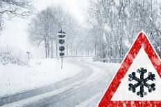 Snowy Curvy Road with Traffic Sign-trendobjects-Laminated Photographic Print