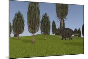 Triceratops Walking across a Grassy Field-null-Mounted Art Print