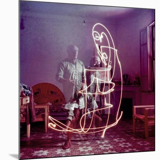 Triple Exposure of Artist Pablo Picasso Drawing with Light at His Home in Vallauris-Gjon Mili-Mounted Premium Photographic Print