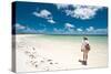 Tropical Beach with Blue Sky and White Sand with Female Looking across Bay-Will Wilkinson-Stretched Canvas