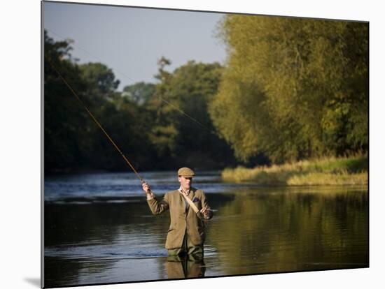 Trout Fisherman Casting to a Fish on the River Dee, Wrexham, Wales-John Warburton-lee-Mounted Photographic Print