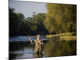 Trout Fisherman Casting to a Fish on the River Dee, Wrexham, Wales-John Warburton-lee-Mounted Photographic Print