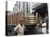 Truck Drivers in Front of Tea Sacks Being Unloaded at Kolkata Port-Eitan Simanor-Stretched Canvas
