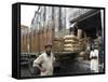 Truck Drivers in Front of Tea Sacks Being Unloaded at Kolkata Port-Eitan Simanor-Framed Stretched Canvas