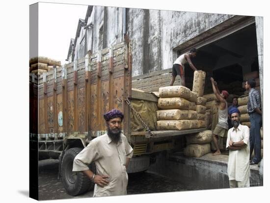 Truck Drivers in Front of Tea Sacks Being Unloaded at Kolkata Port-Eitan Simanor-Stretched Canvas